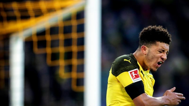 Borussia Dortmund mantuvo el liderato al igualar en una guerra de goles ante Hoffenheim