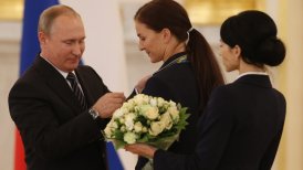 Putin condecoró a medallistas rusos en Río y les regaló un auto BMW