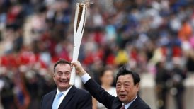 Atenas despidió la llama olímpica, que puso rumbo a Corea del Sur